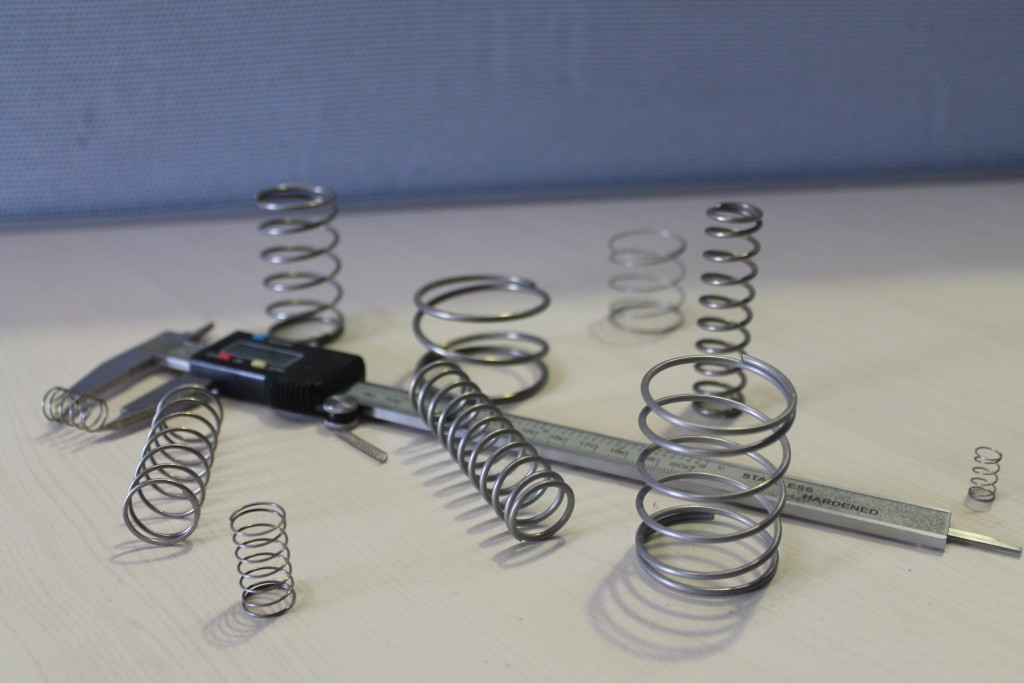 A variety of compression springs with a gauge